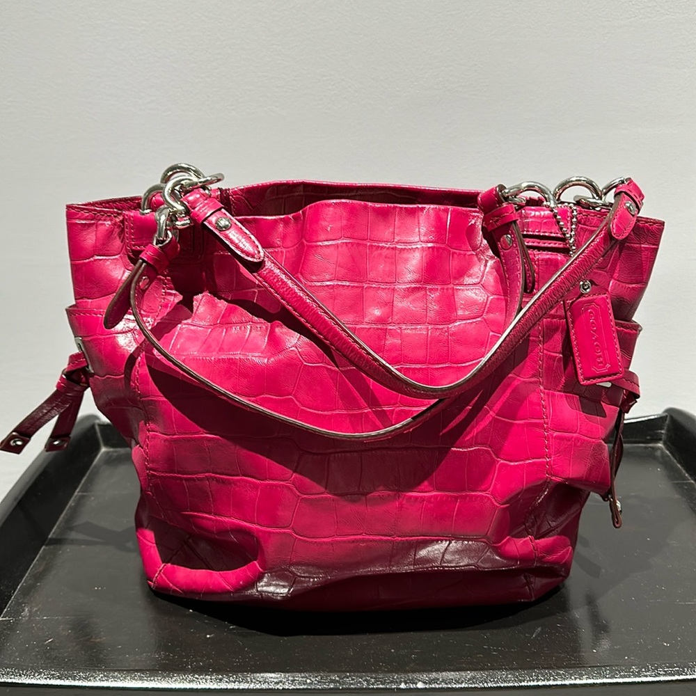Coach Hot pink crocodile embossed bag.
